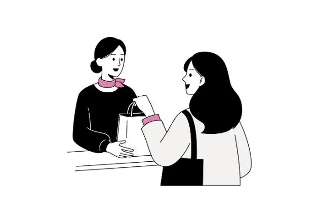 店員が客に商品を手渡すイラスト