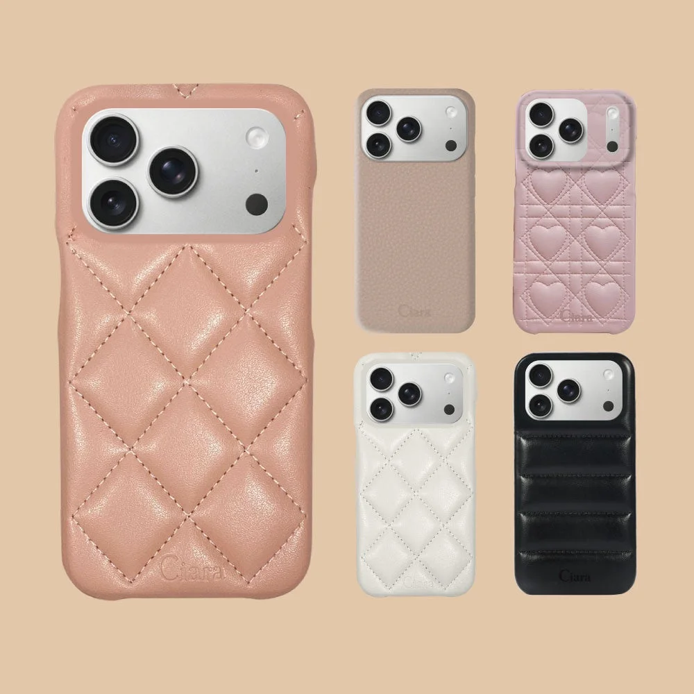 様々な色とデザインのスマートフォンケースが複数並べられています。キルティングやハート柄、無地などがあり、Claraというブランド名が見えます。