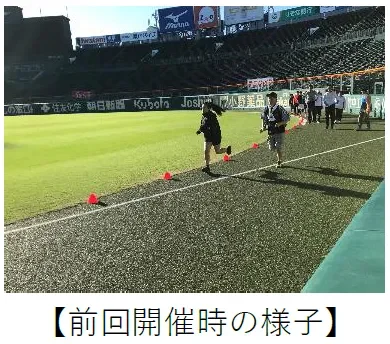 スタジアムのトラックでランニングする人々
